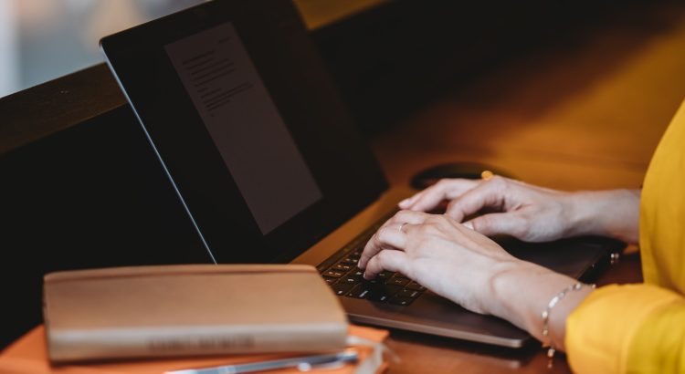 person using black laptop computer